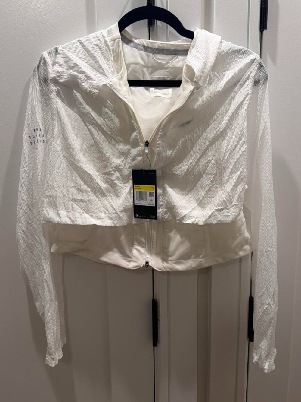 Nike white cover jacket with subtle textured pattern